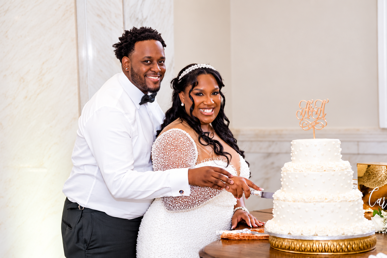 Aaliyah and Alex cutting their wedding cake