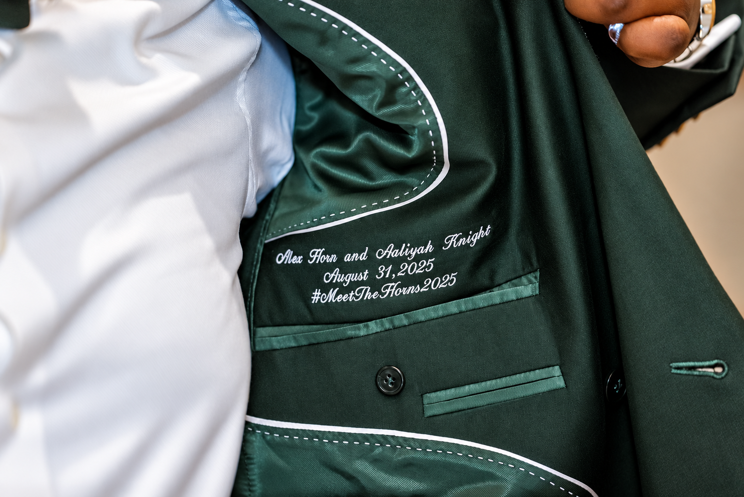 Personal detail on Alex's wedding jacket