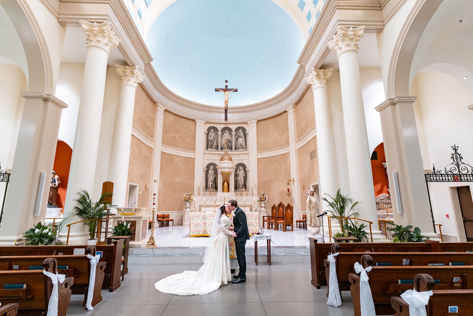 Will and Tori kiss beneath the blue-and-white church ceiling