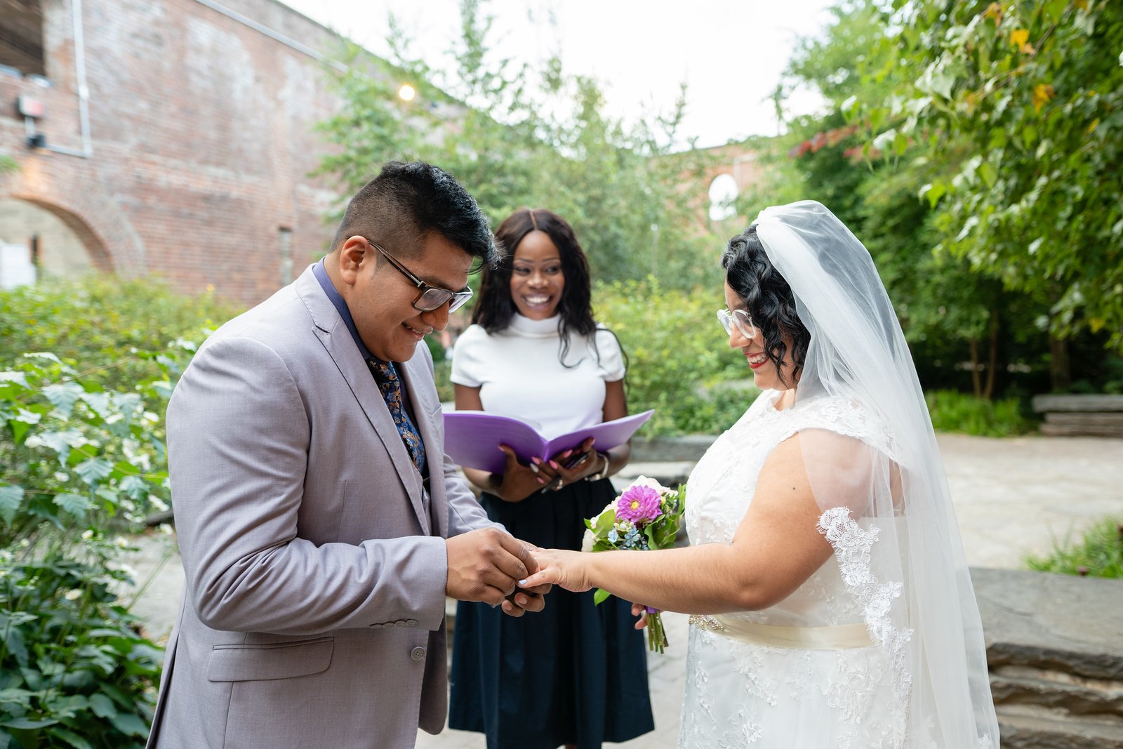 Brenda and David exchange rings during their ceremony.