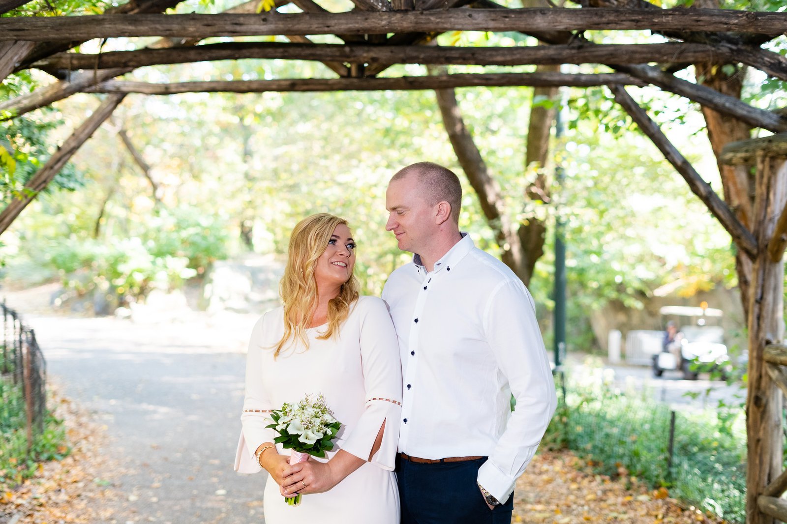 Mary and Shamus look at each other beneath the arch.