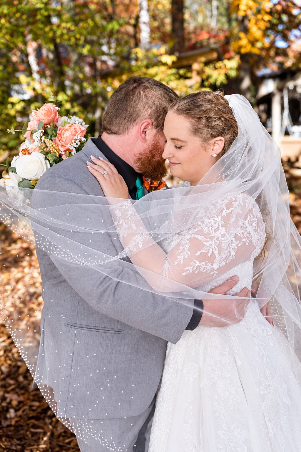 Danielle and Trey—couple beneath the veil