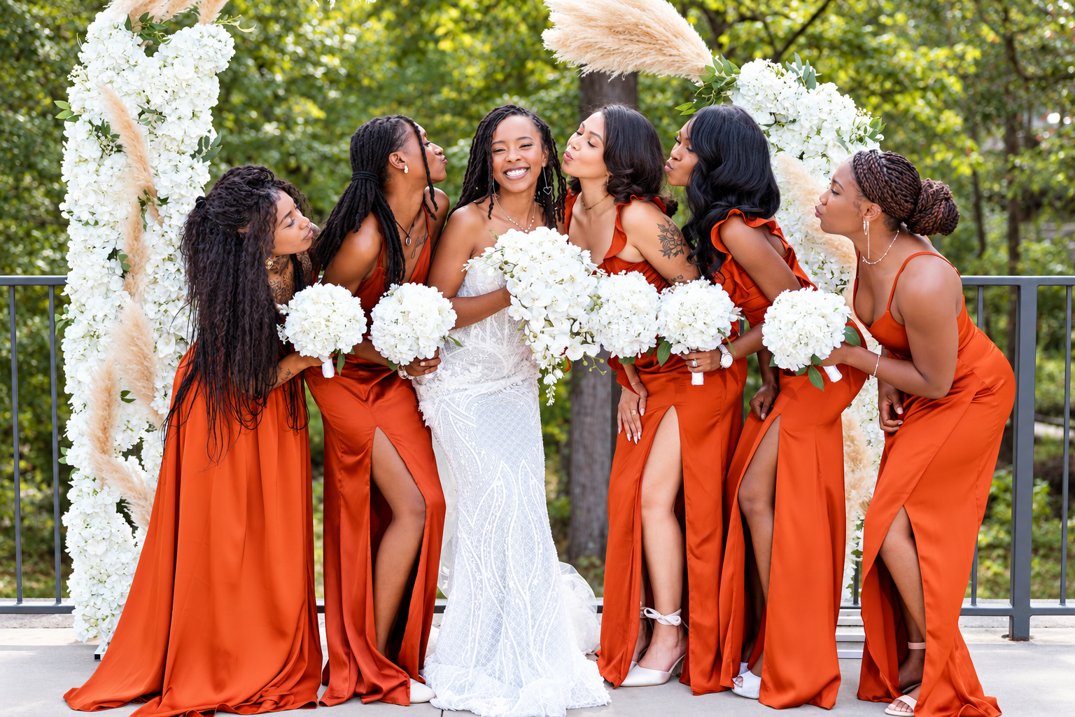 Bride bridesmaids orange dresses at Burnett and Jaelyn's wedding