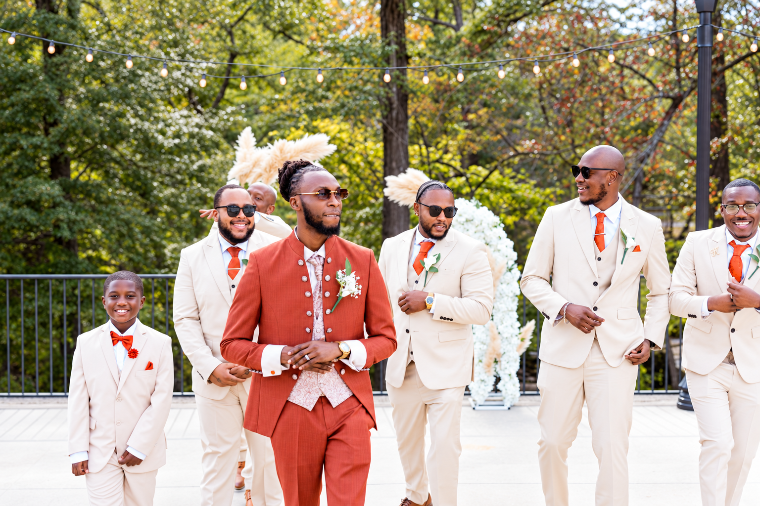 Groom groomsmen ivory suits at Burnett and Jaelyn's wedding