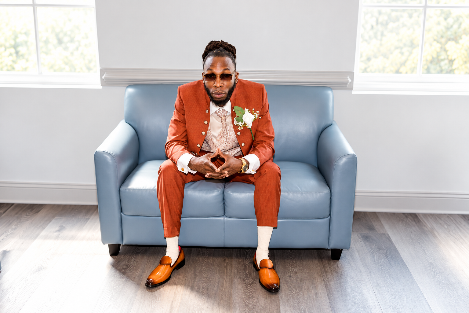 Groom orange suit portrait at Burnett and Jaelyn's wedding