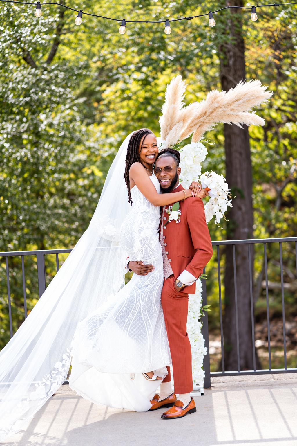 Joyful couple lift portrait at Burnett and Jaelyn's wedding