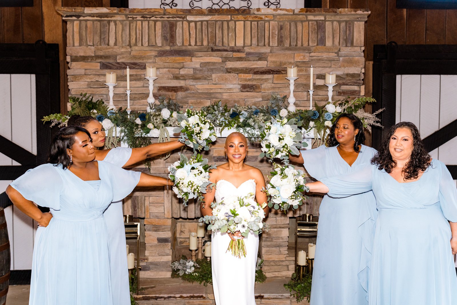 Jillian's bridesmaids raise their bouquets around her