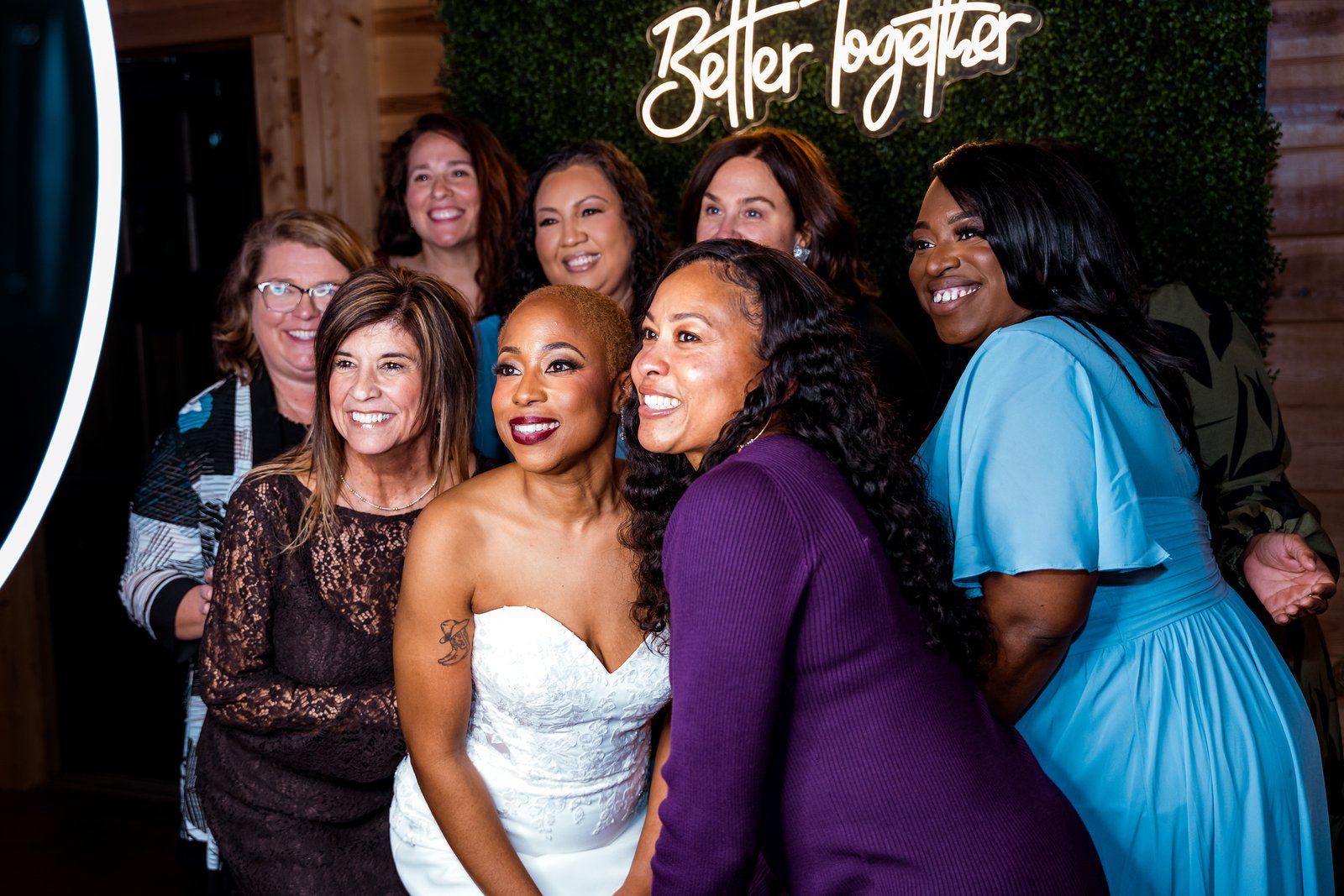 Jillian and her friends smile together at the photo booth