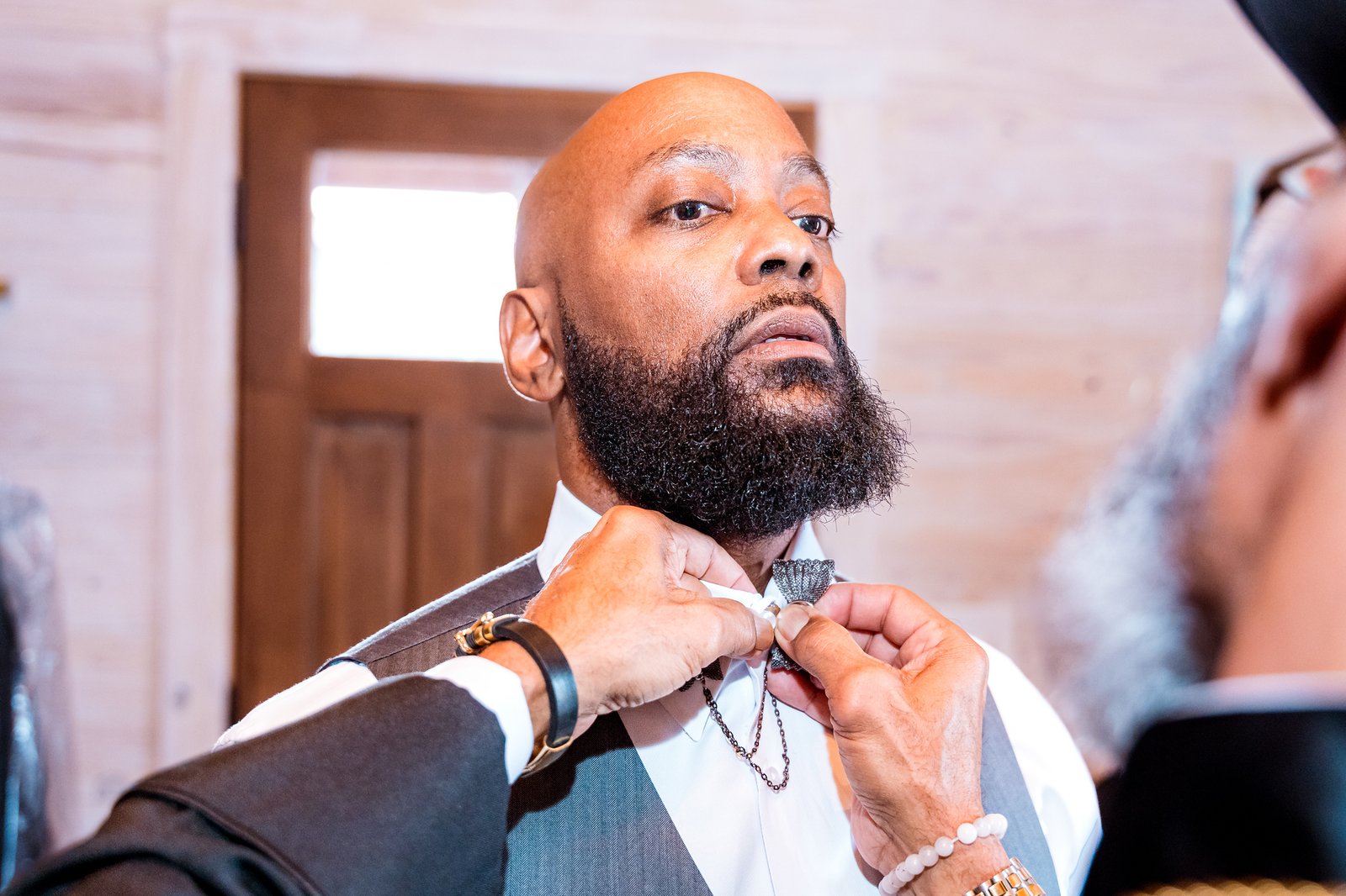 The finishing touches to Maurice's bow tie before the ceremony