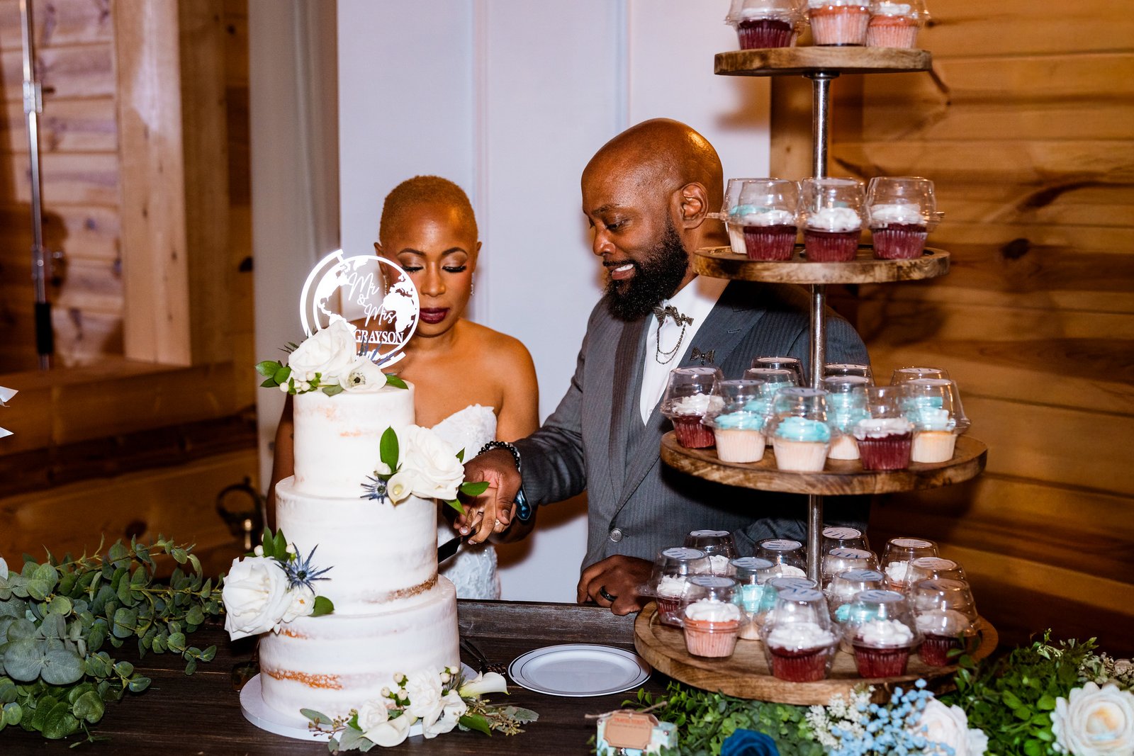 Maurice and Jillian cut their wedding cake together
