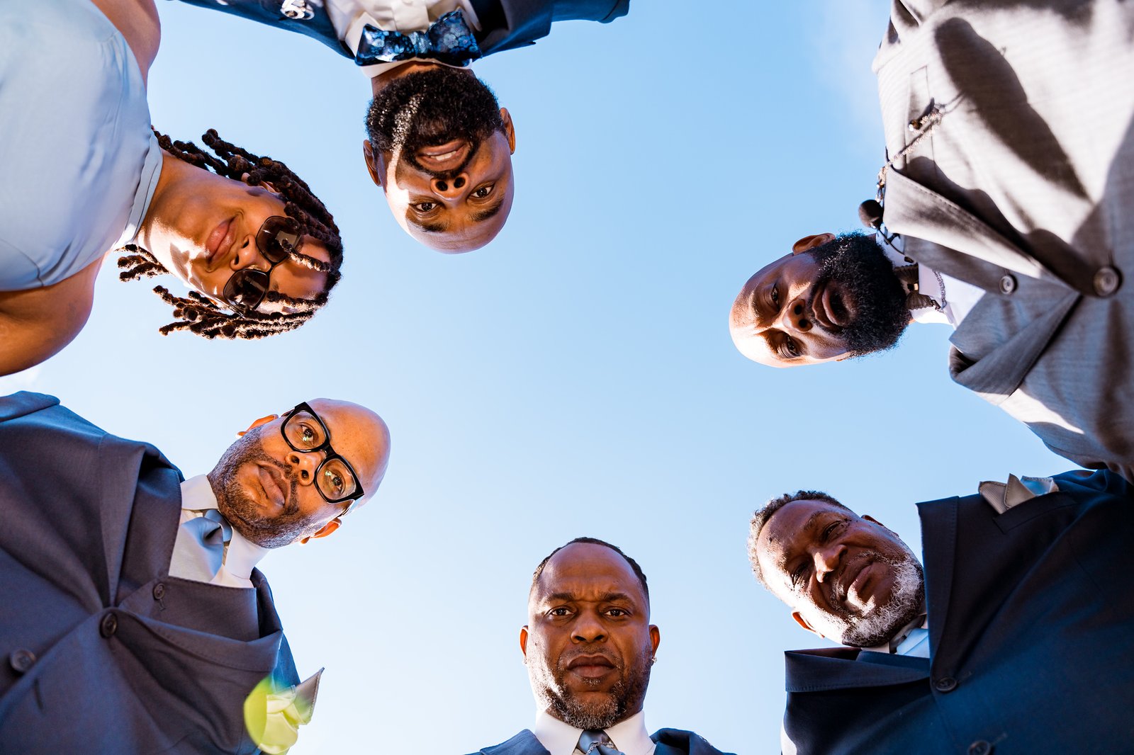 Maurice and his wedding party gather for a playful overhead portrait