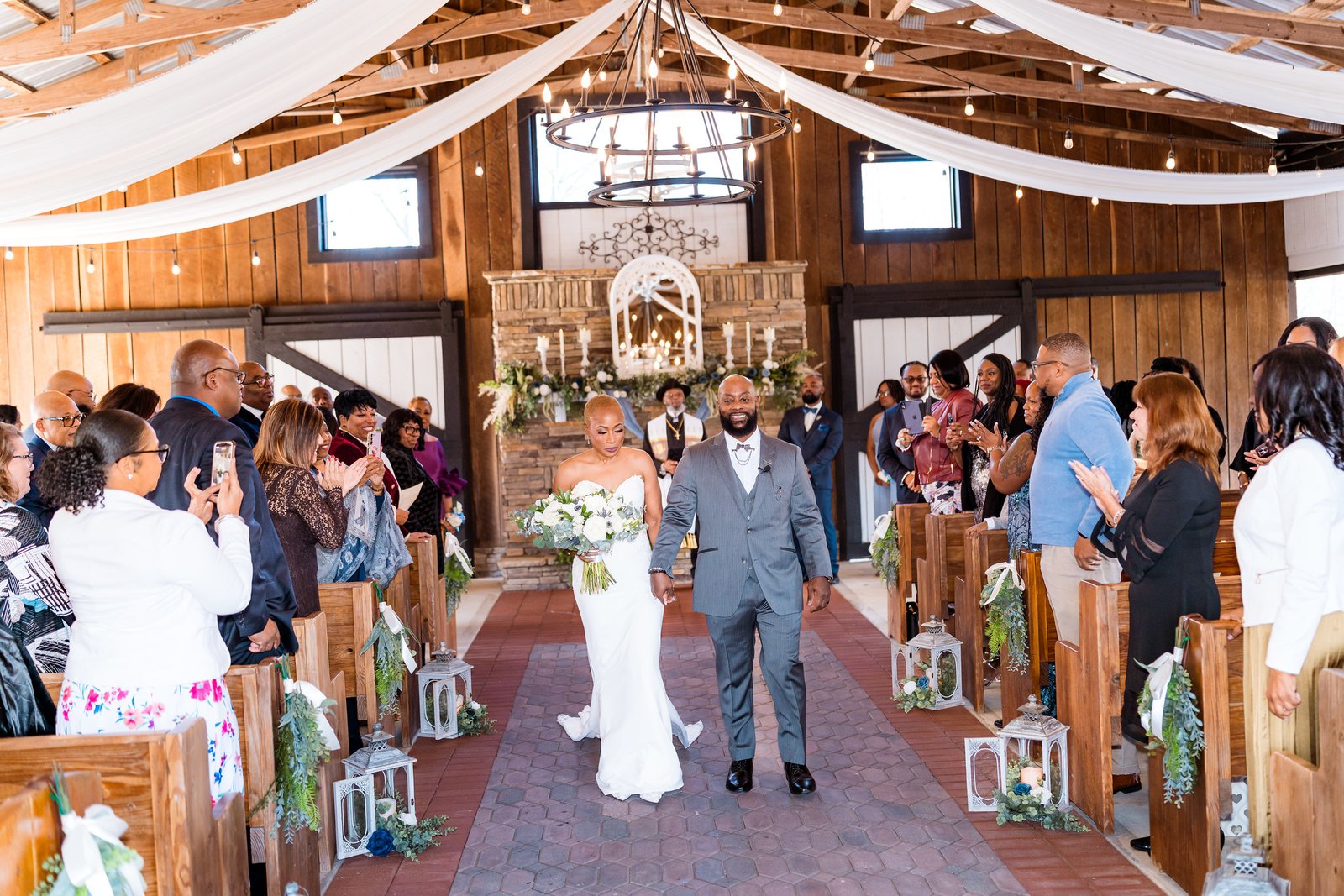 Maurice and Jillian walk back down the aisle smiling
