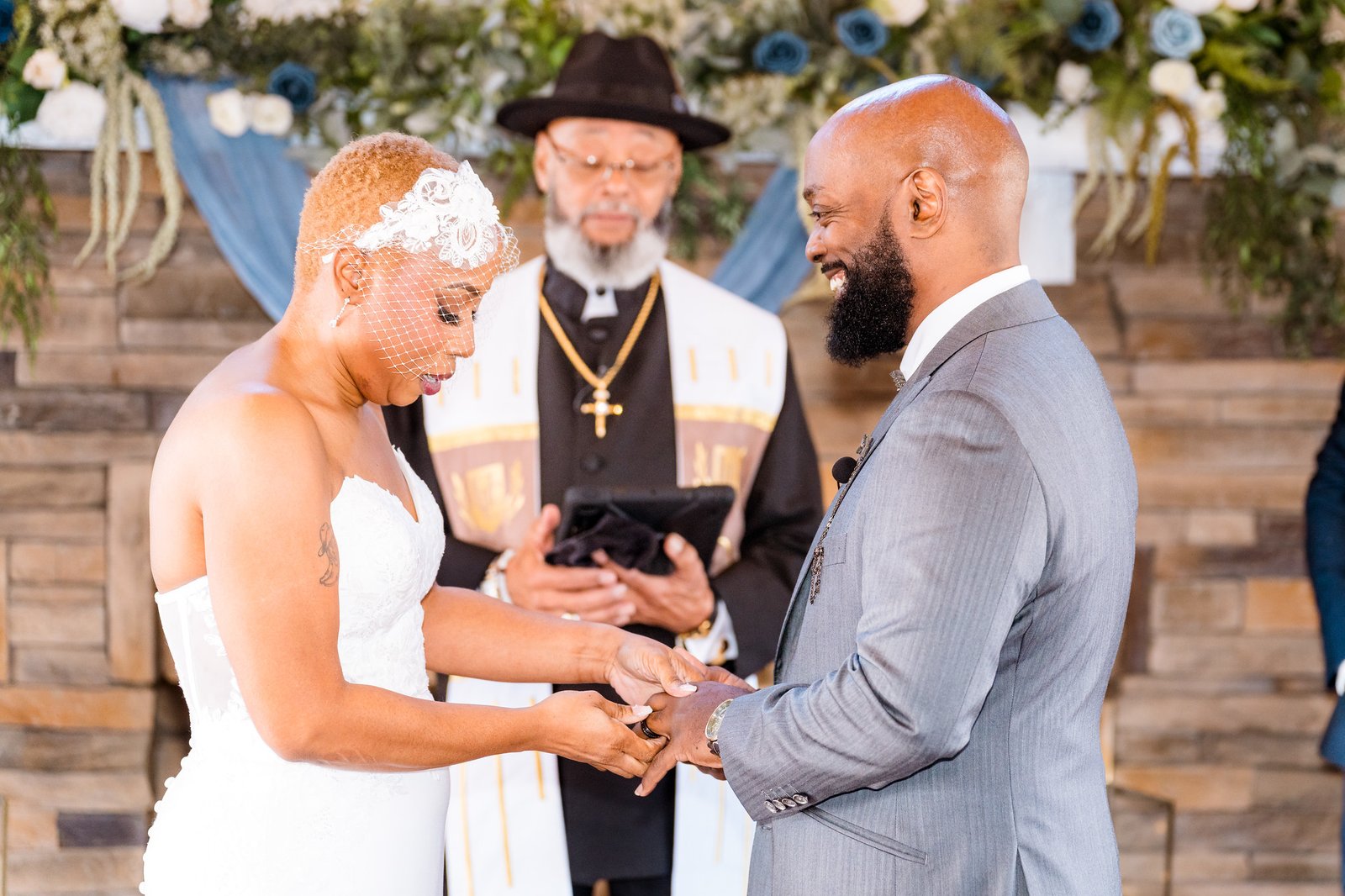 Jillian places Maurice's wedding ring on his finger