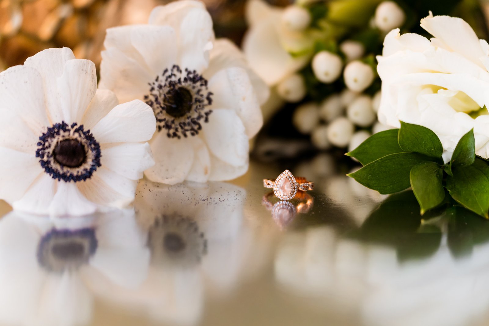 Wedding rings among white flowers