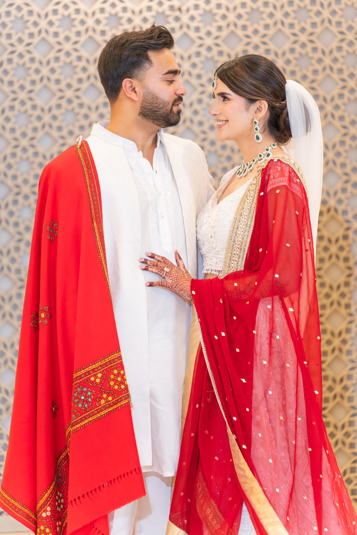 Mehreen and Shahzain share a close portrait with a red embroidered shawl