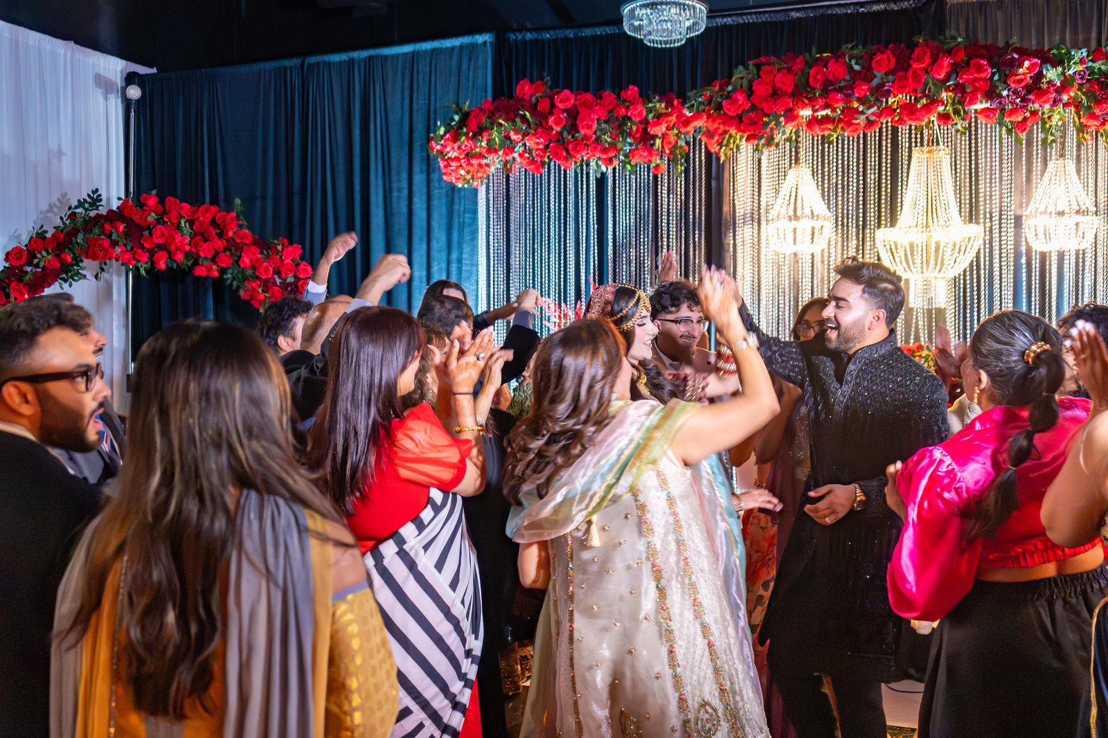 Guests celebrate with Mehreen and Shahzain on the dance floor