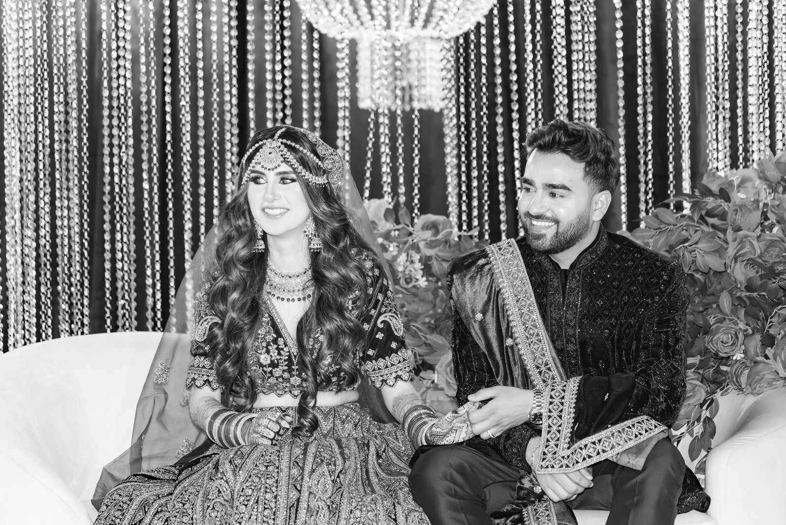 Mehreen and Shahzain smile during the speeches in black and white