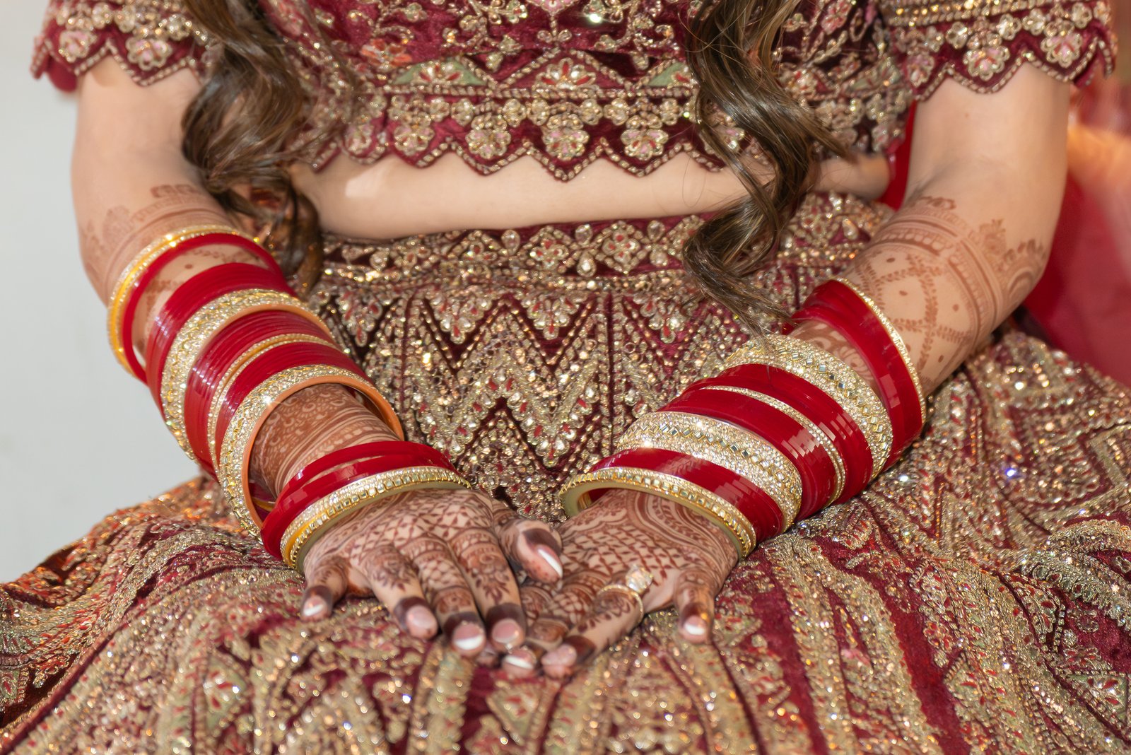 Mehreen's henna, red bangles and embroidered reception gown