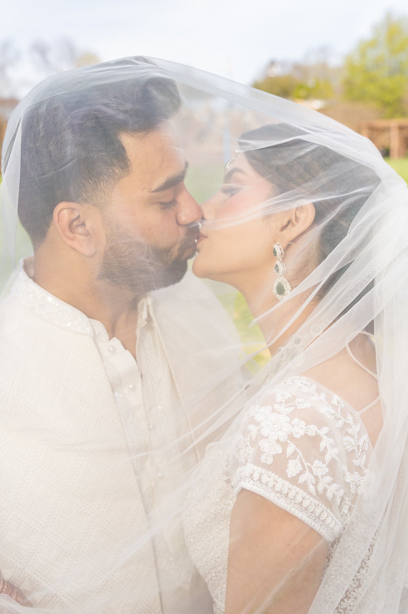 Mehreen and Shahzain share a kiss beneath her white veil