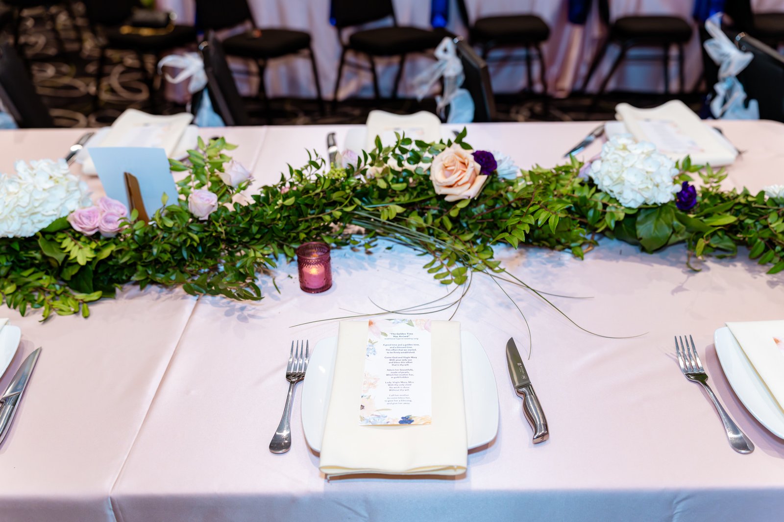 Pink place setting and floral table details