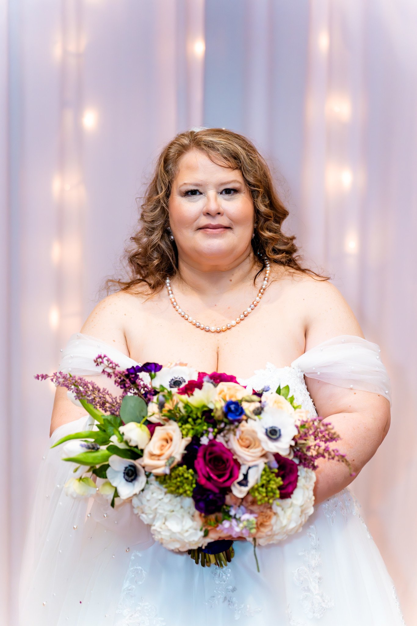 Towanna holds her bouquet for a bridal portrait