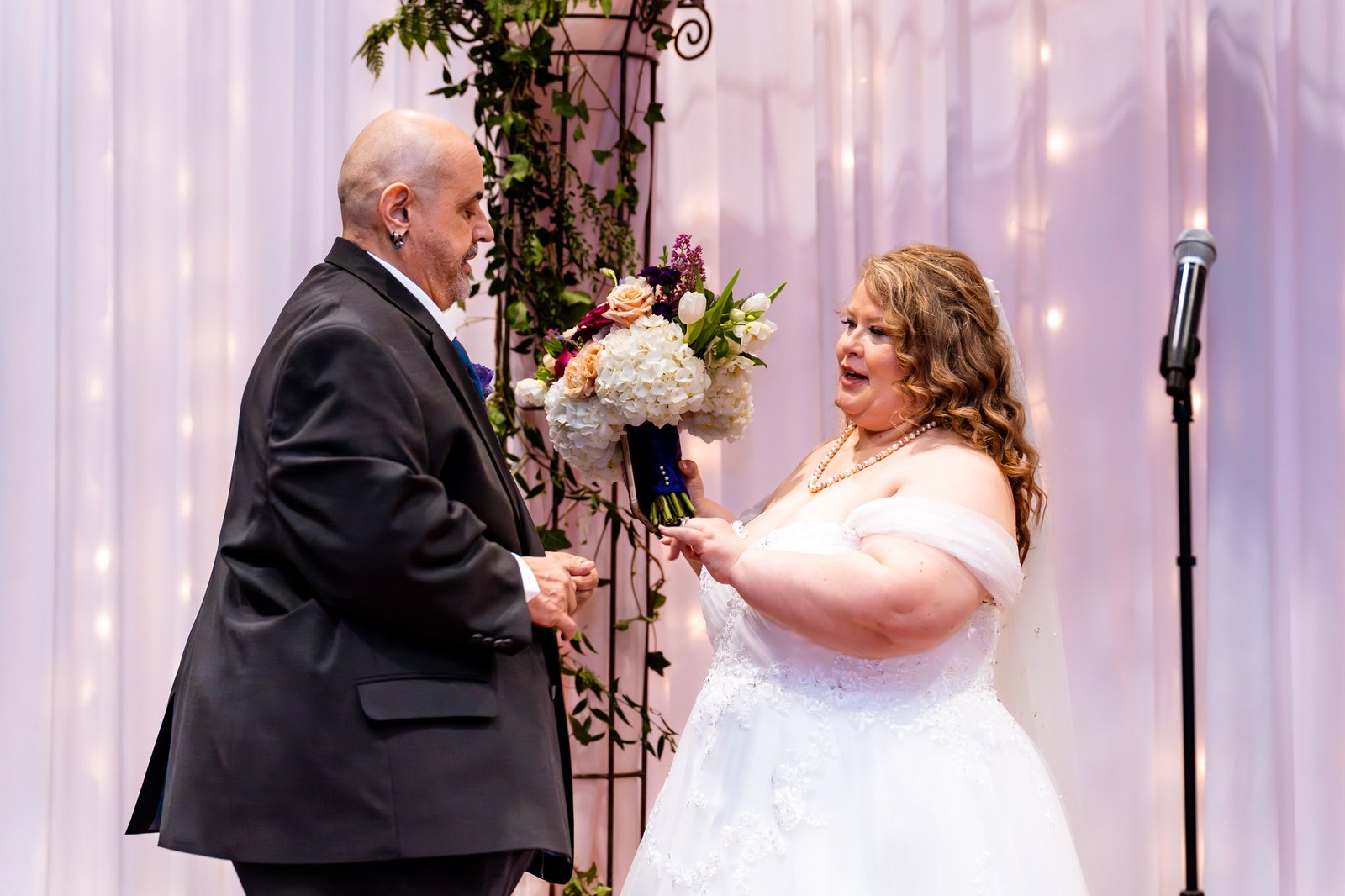 Towanna speaks as the couple share a laugh during the ceremony