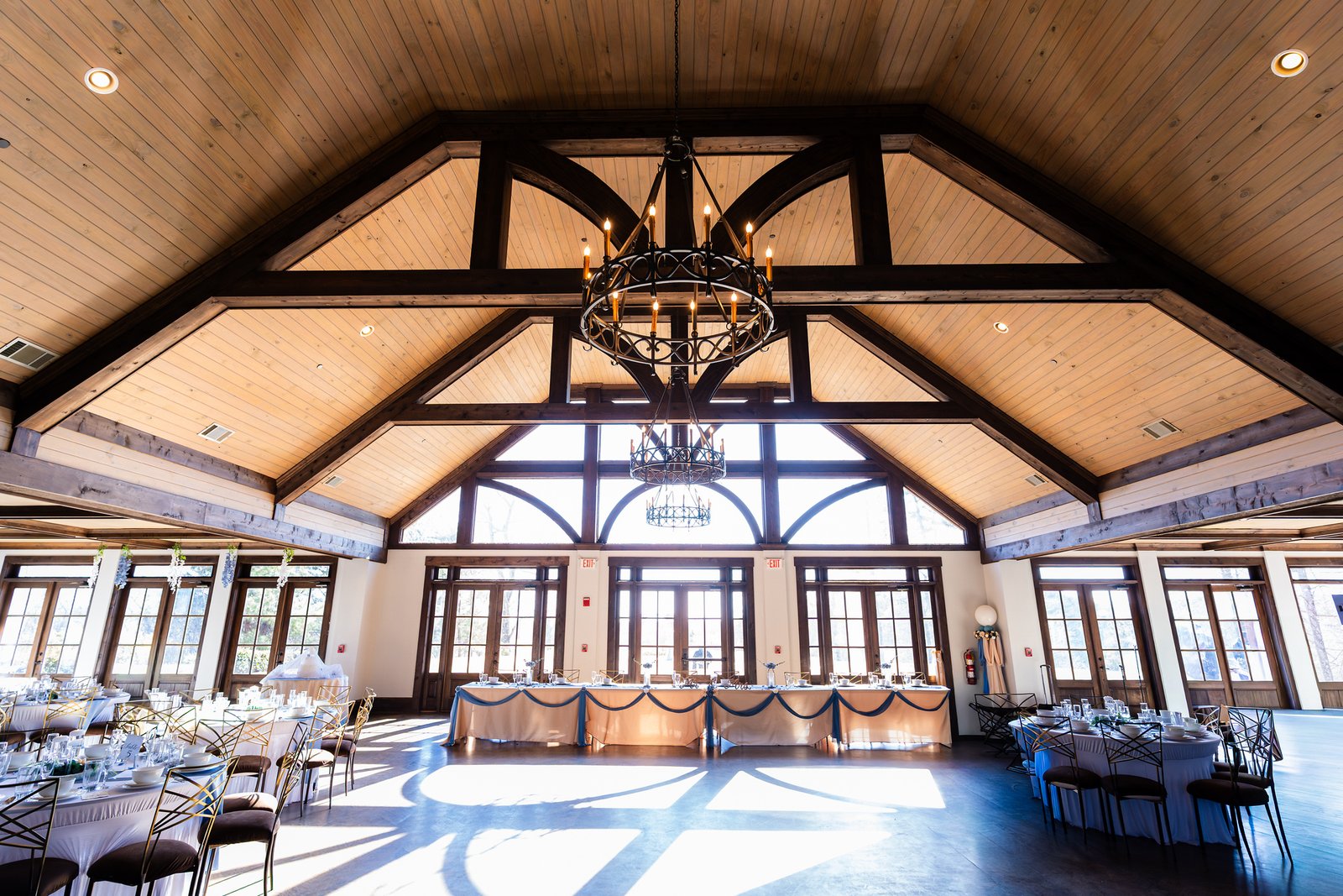 Sunlight falls across the timber-framed reception room
