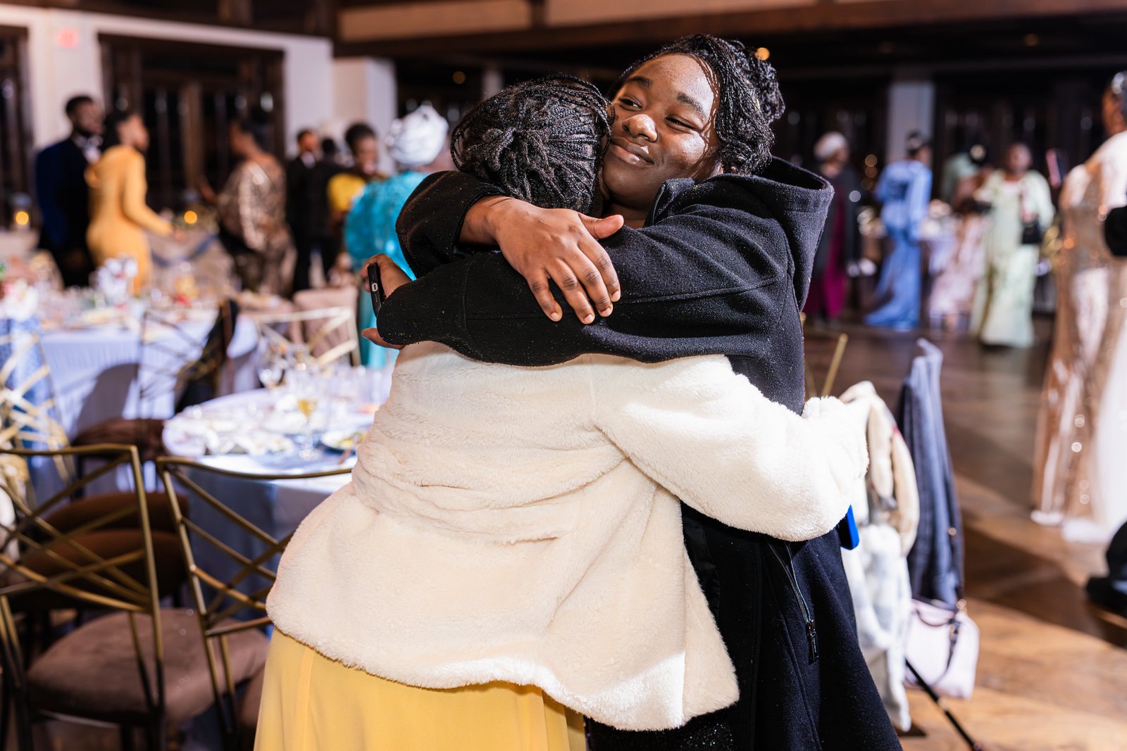 Guests share a warm embrace at the end of the celebration