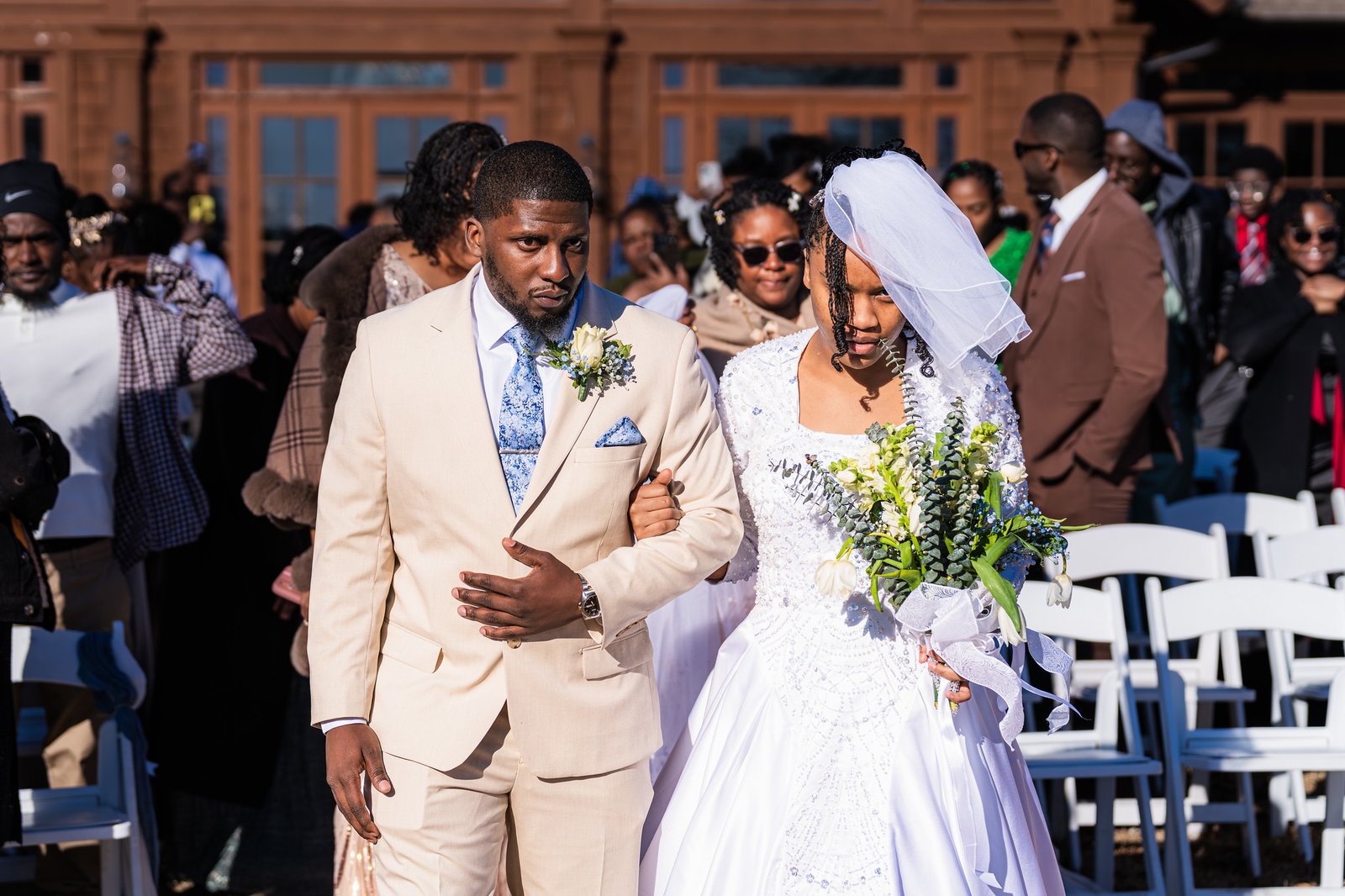 Tanjana and Marcel walk together down the aisle