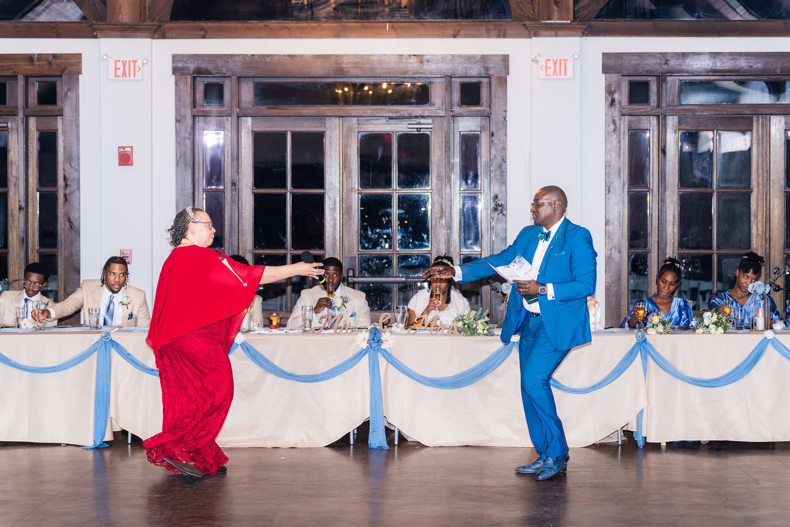 Guests share a playful moment on the reception floor