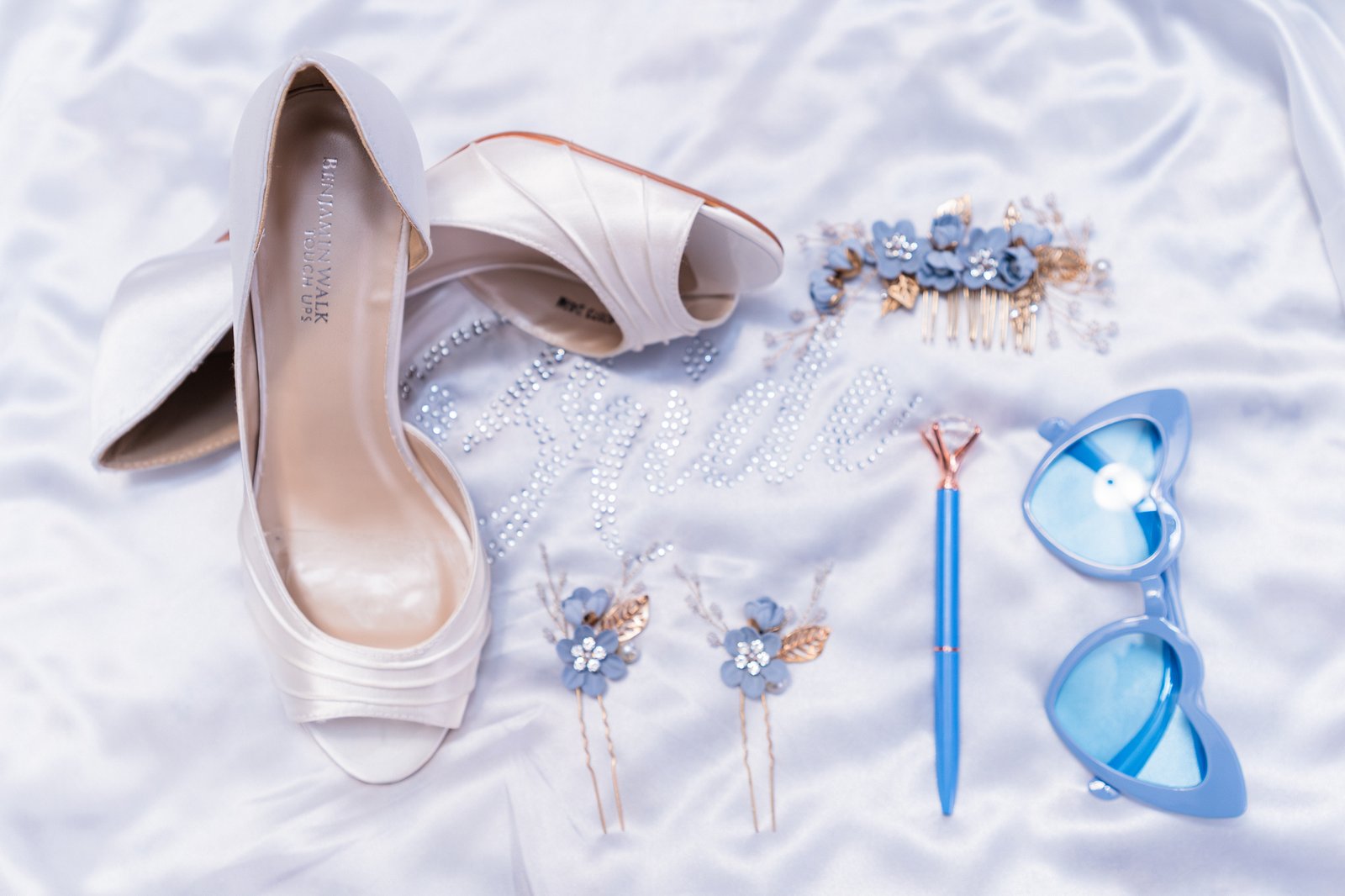 Bridal shoes, blue jewelry and wedding accessories
