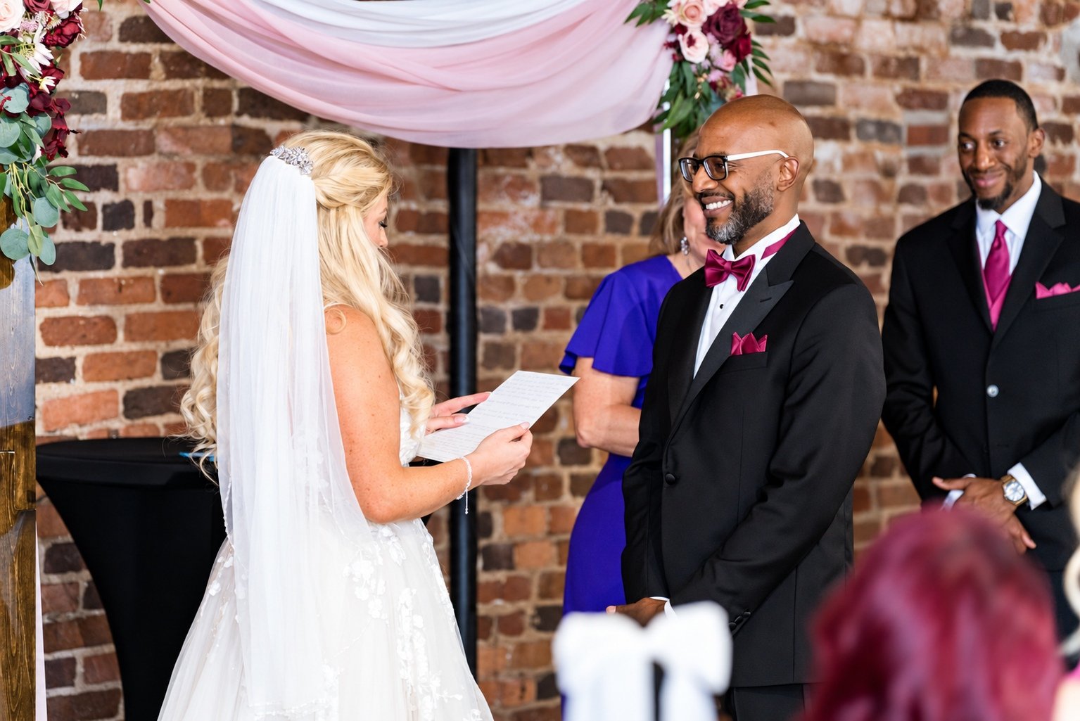 Mikayla reading her vows to Franz at Boxwood Social Hall