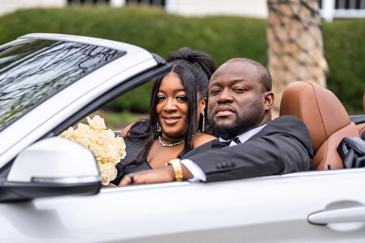 Kobina and Tiara seated in the convertible