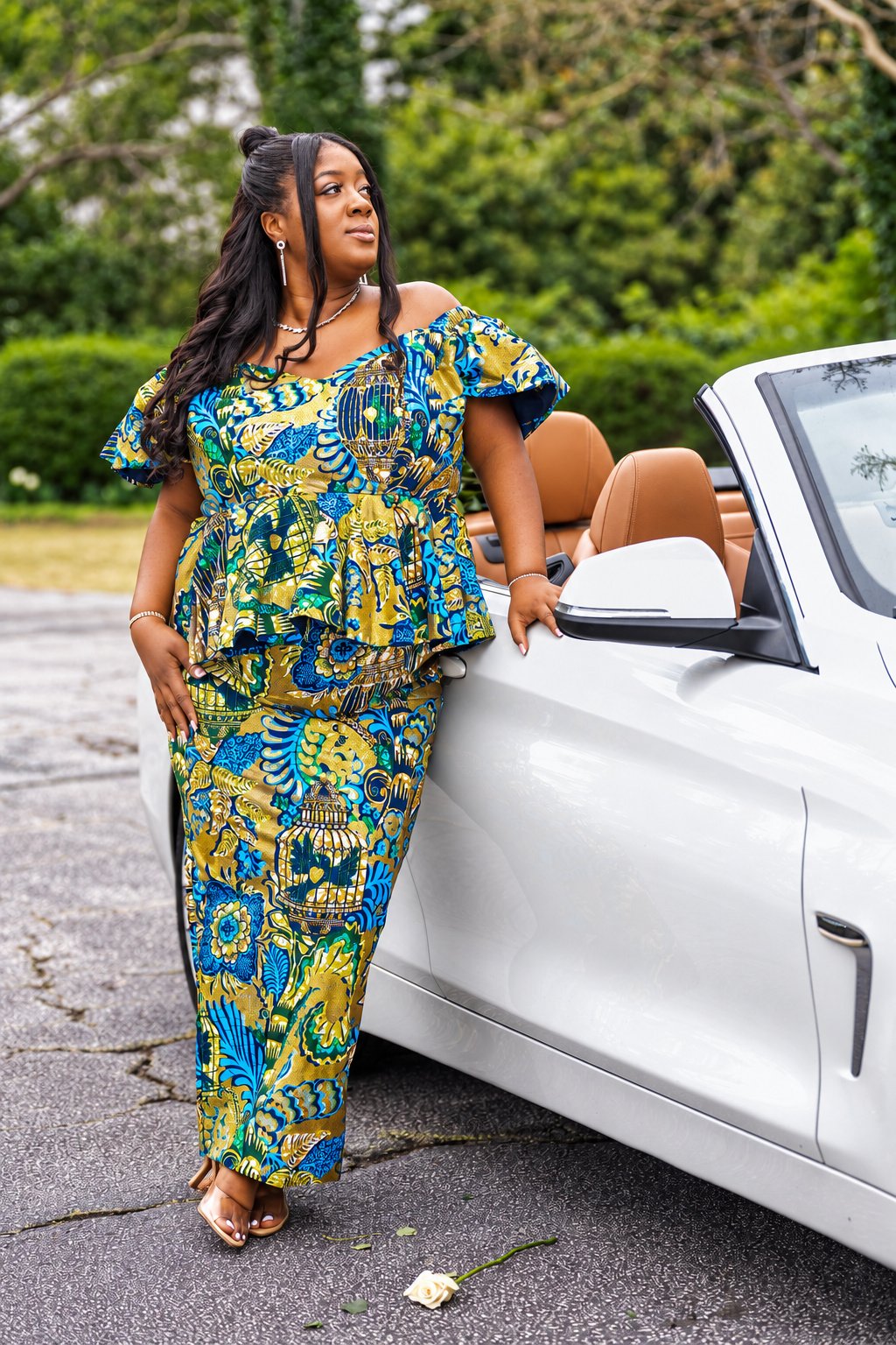 Tiara in a blue, green and gold patterned outfit