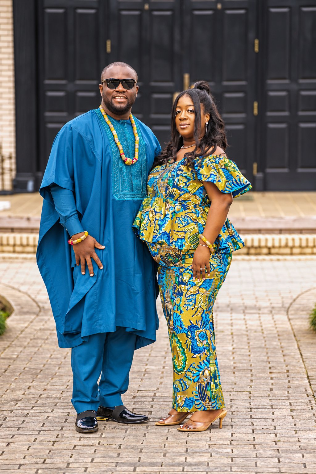 Couple in colorful attire and sunglasses