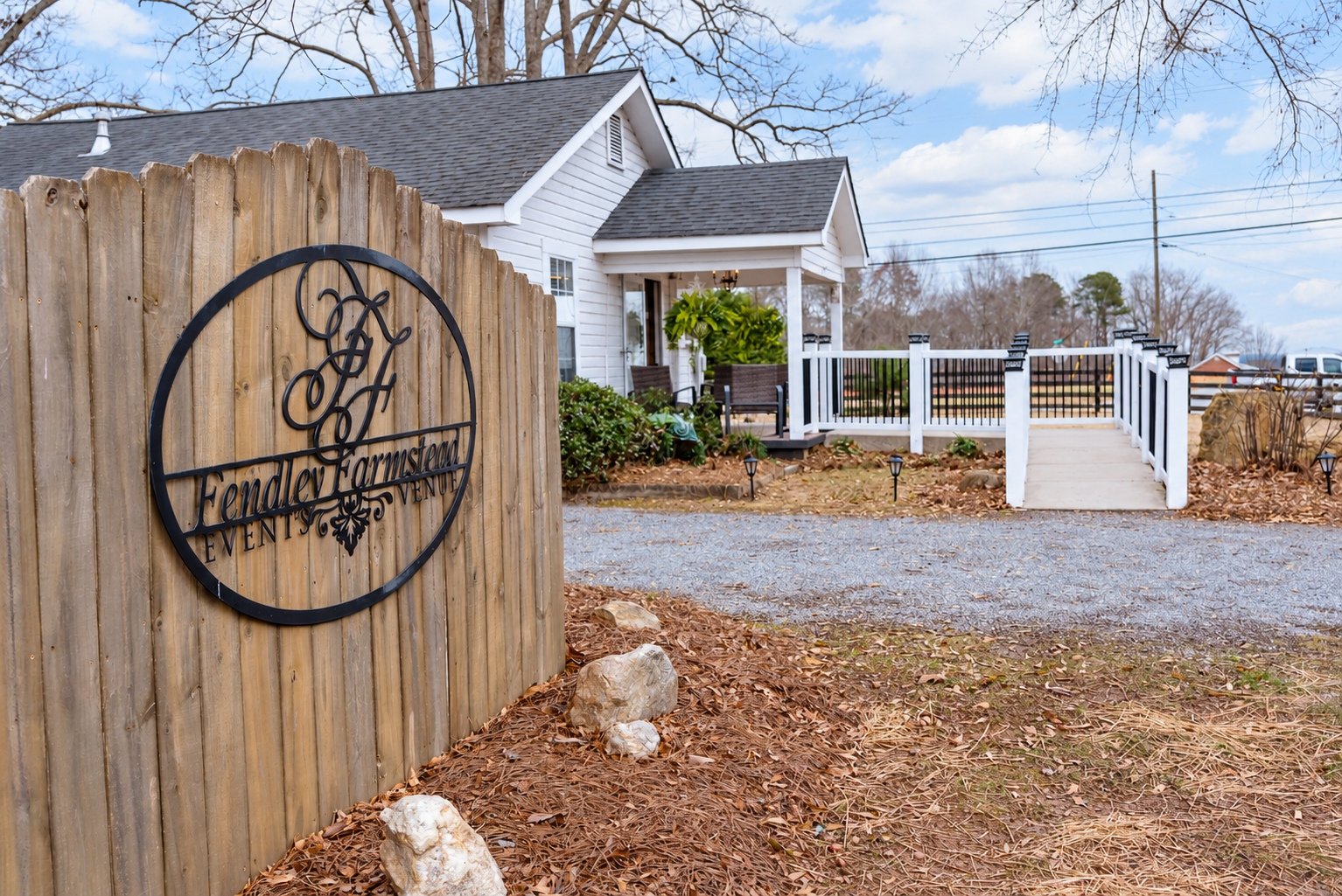 Fendley Farmstead exterior and wooden entrance sign in Canton, Georgia