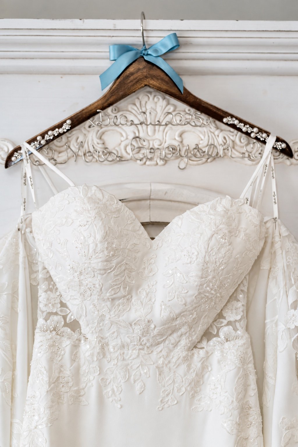 Jillian’s lace wedding gown hanging before the ceremony