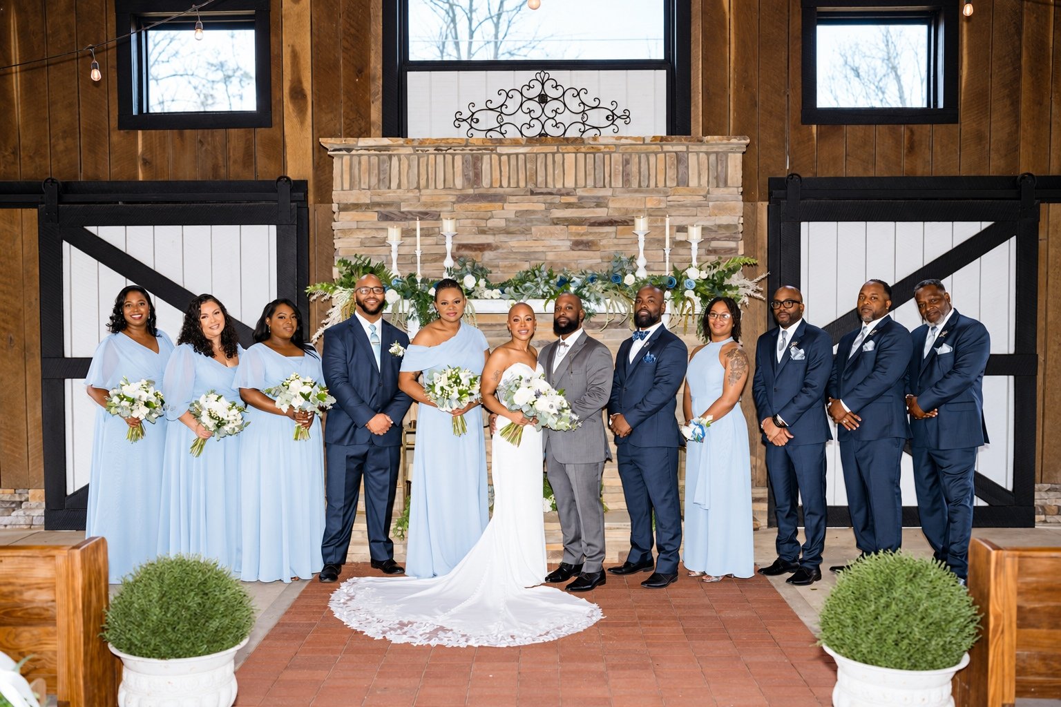 Maurice and Jillian with their wedding party at the ceremony altar