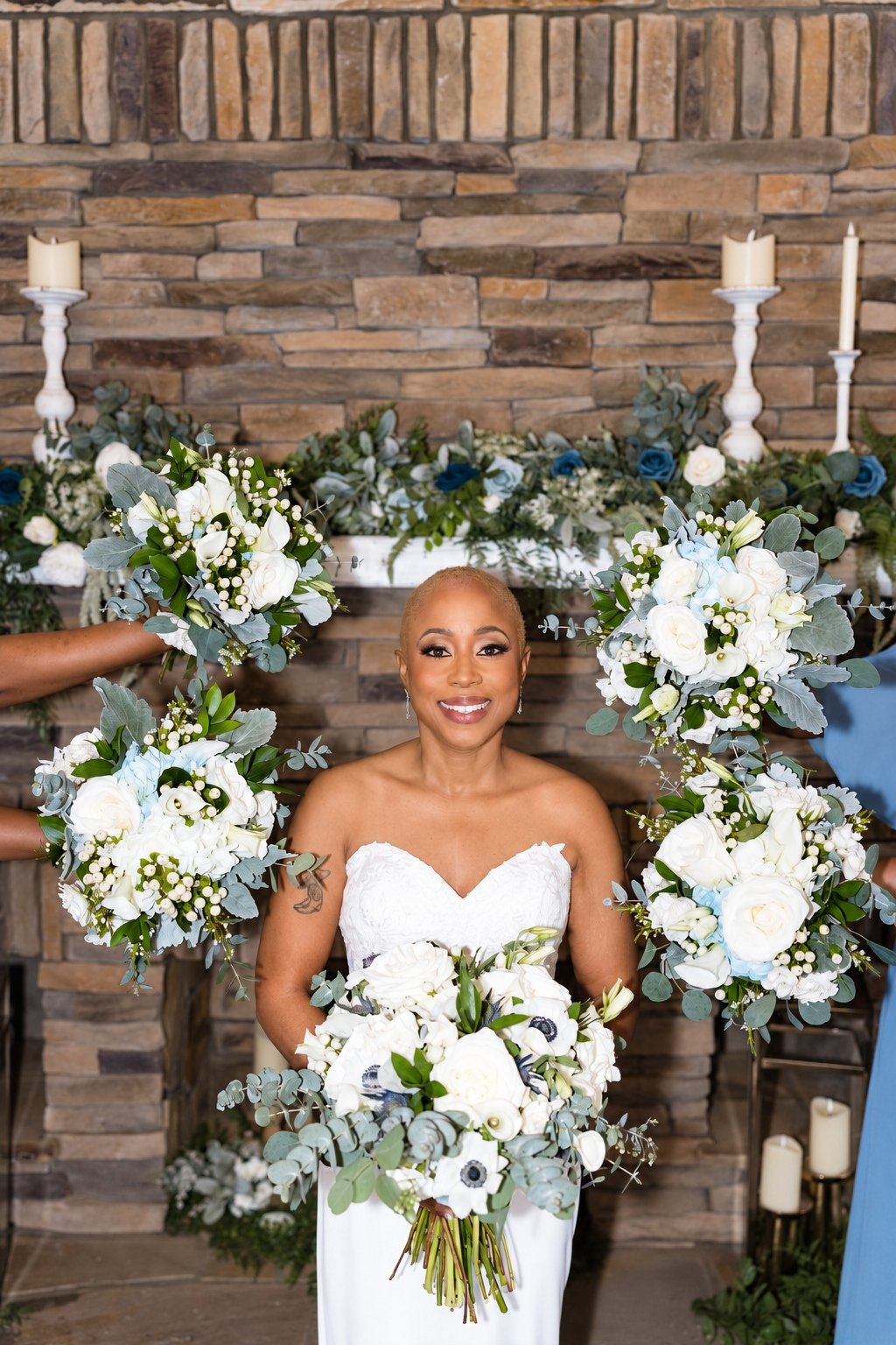 Jillian’s bridal portrait framed by white and blue flowers at Fendley Farmstead