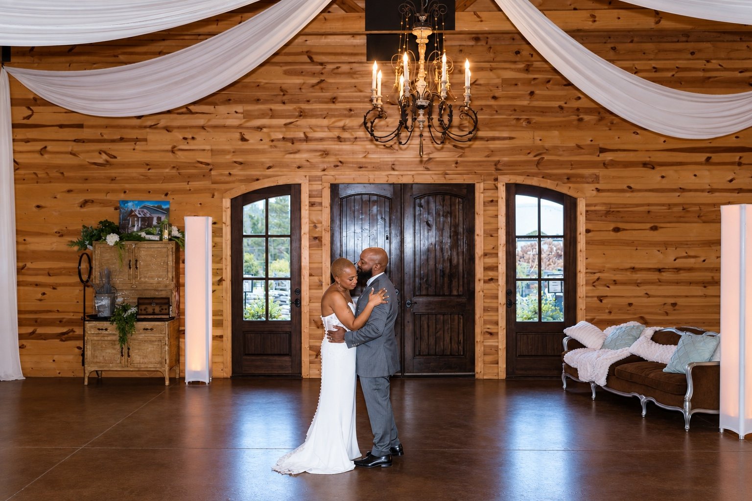 Wide view of Maurice and Jillian dancing in the reception room