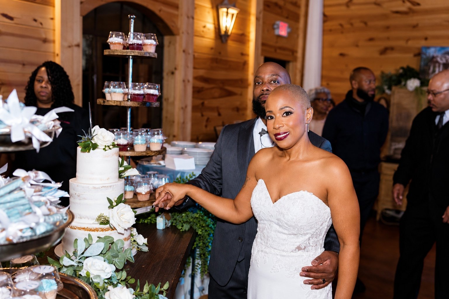 Jillian smiling during the wedding cake cutting