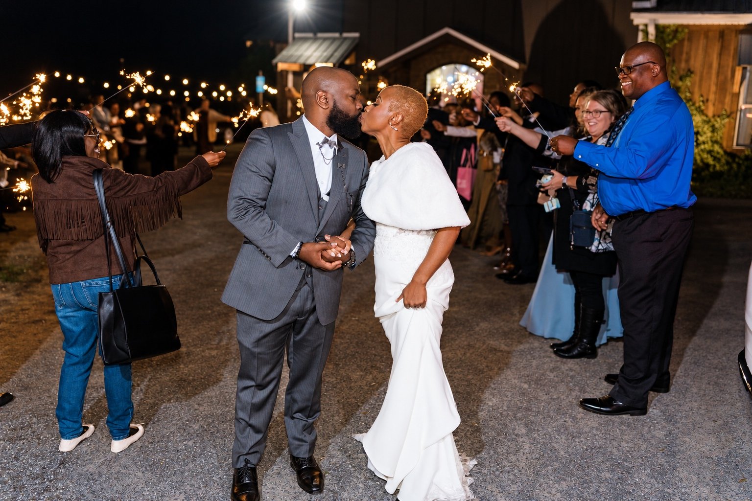 Maurice and Jillian kissing during their sparkler send-off