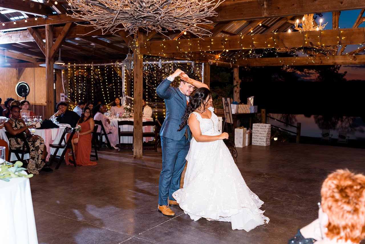 Reeham and Logan dance together in the reception barn