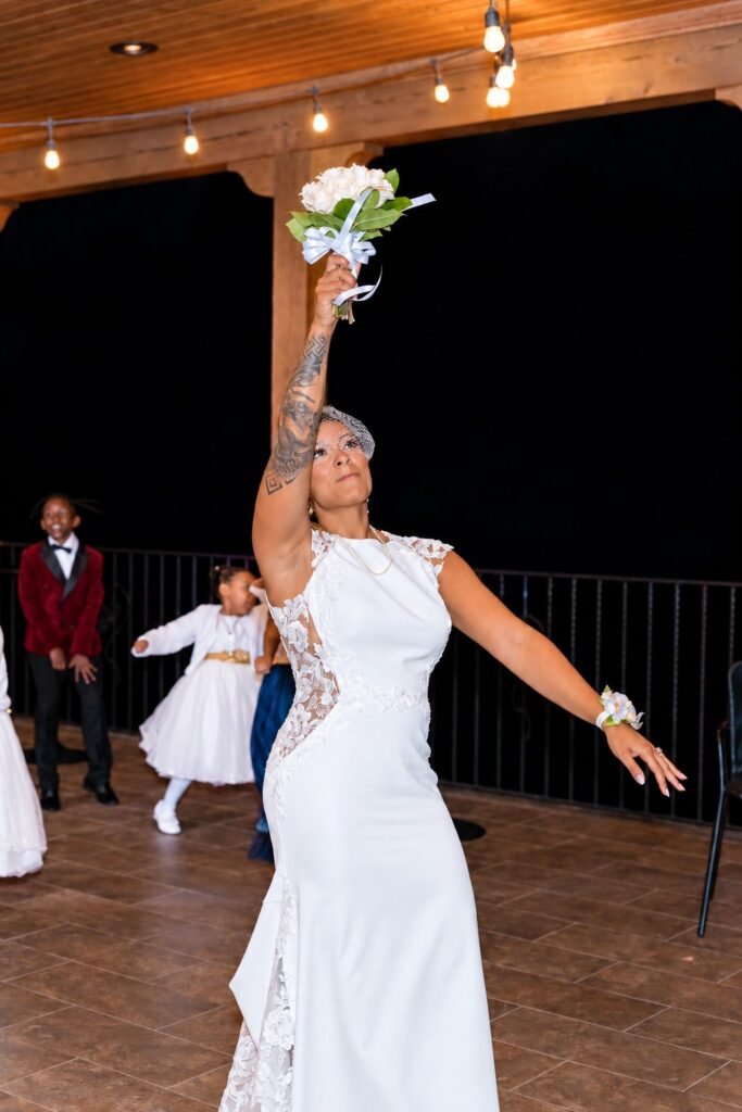 Bride tossing her bouquet at Montaluce Winery in Dahlonega, Georgia.
