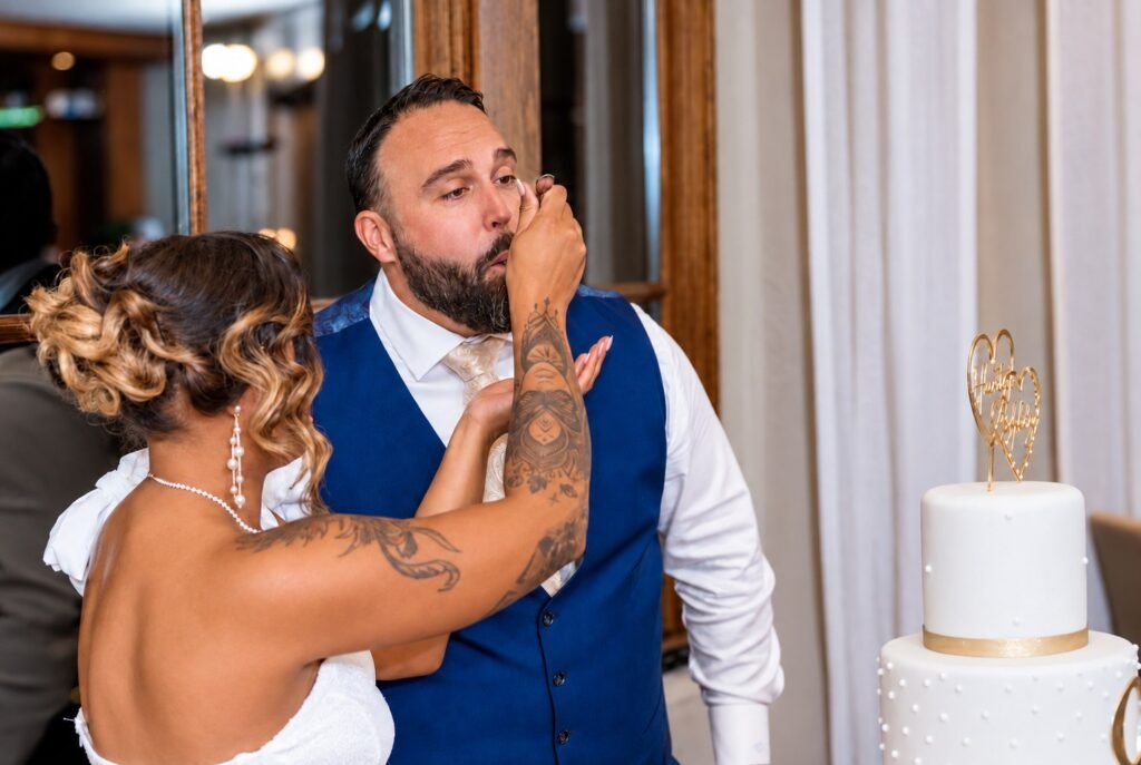 Couple sharing wedding cake at Montaluce Winery in Dahlonega, Georgia.