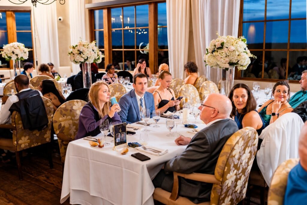 Reception guests, tables and floral arrangements at Montaluce Winery in Dahlonega, Georgia.